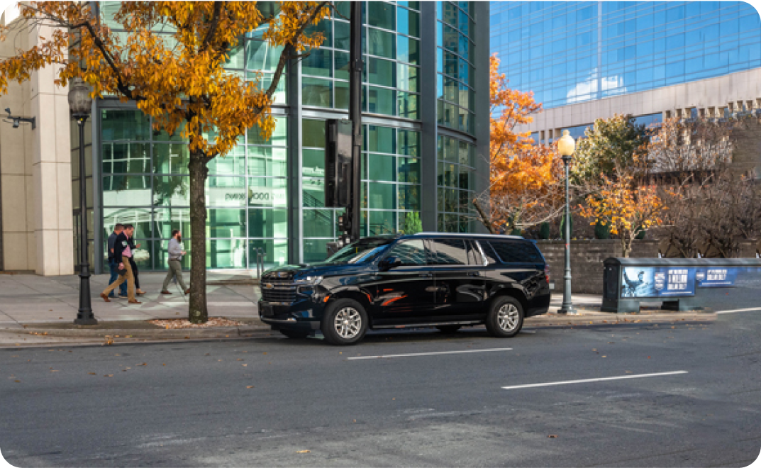 Professional chauffeur with luxury vehicle